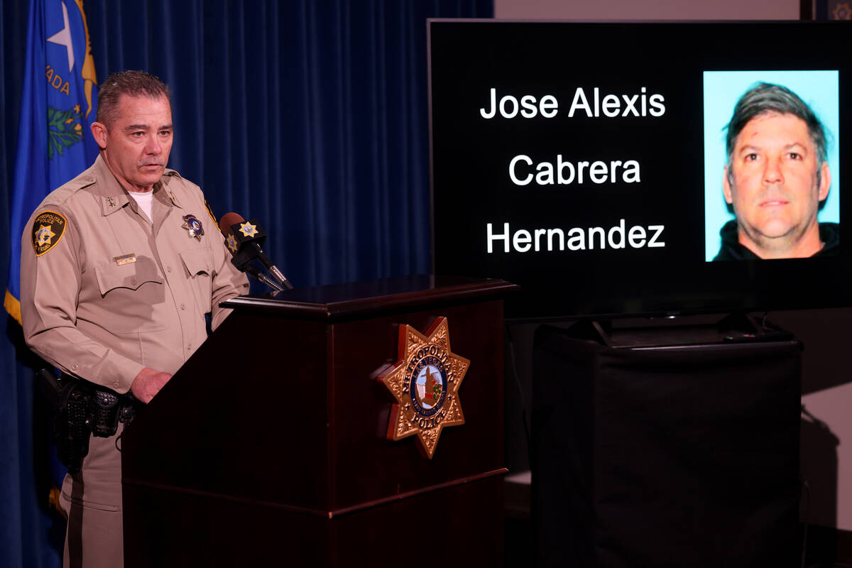 Assistant Sheriff Andrew Walsh shows a photo of Jose Cabrera Hernandez during a news conference ...