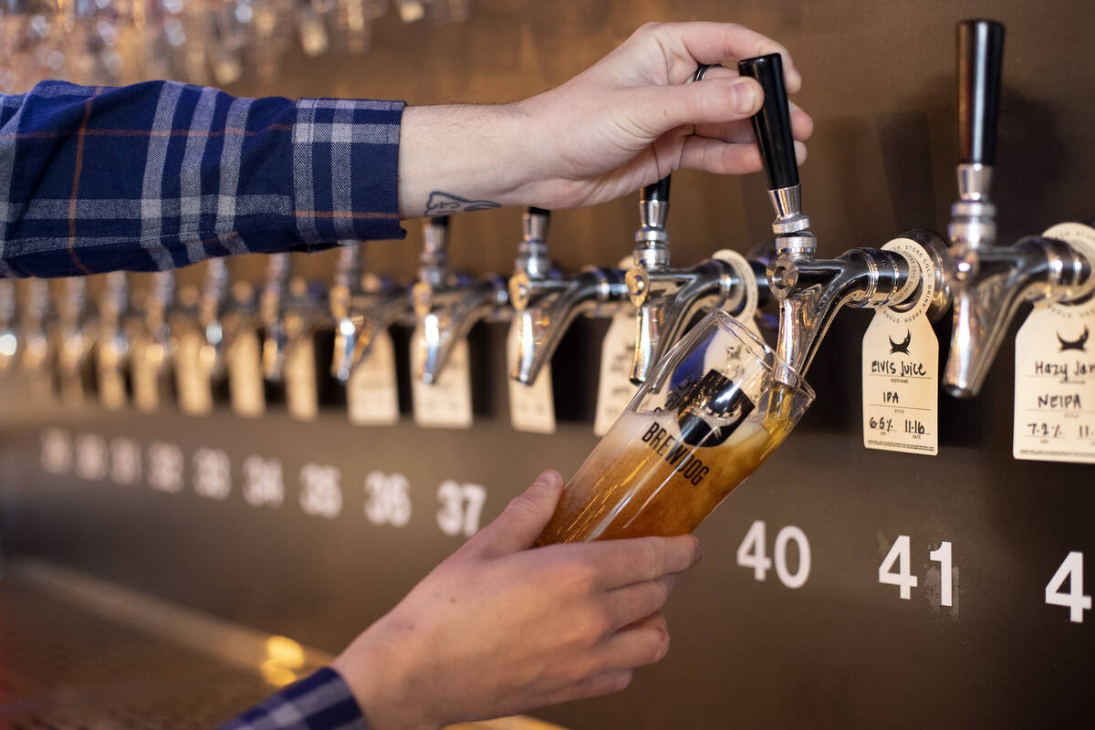 An Elvis Juice beer is poured at the new BrewDog atop Showcase Mall on Friday, Nov. 18, 2022, i ...