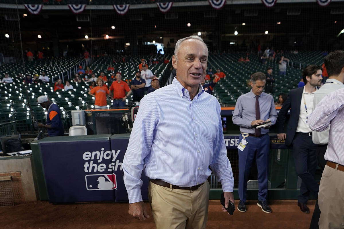 Major League Baseball Commissioner Rob Manfred walks on the field before Game 2 of an American ...