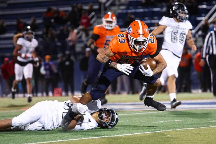 Bishop Gorman’s Trech Kekahuna (23) gets stopped by Desert Pines’ Lono Solomonn ( ...