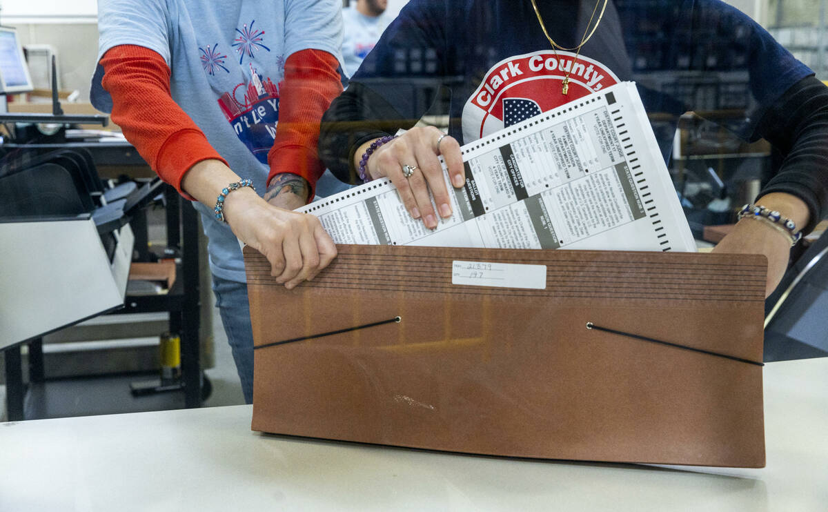 Workers bundle ballots as sorting continues for final tabulations at the Clark County Election ...