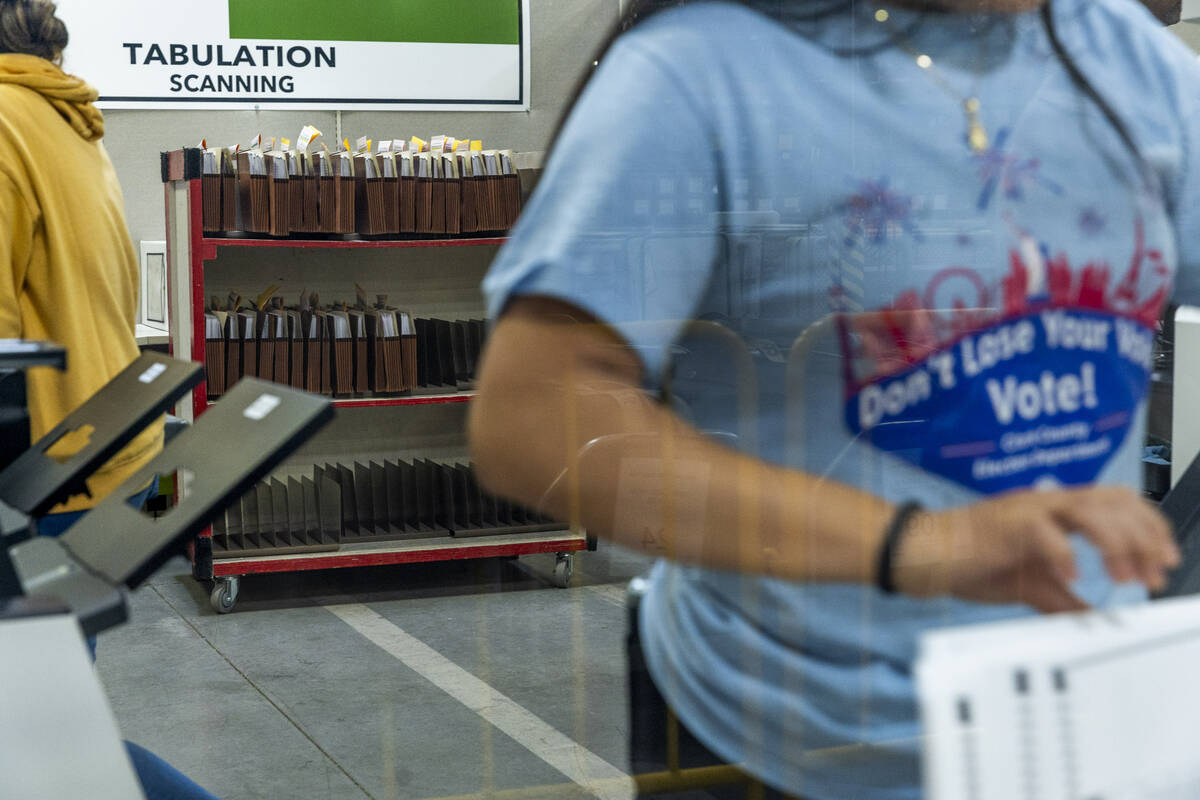 Workers continue sorting ballots for final tabulations at the Clark County Election Department ...
