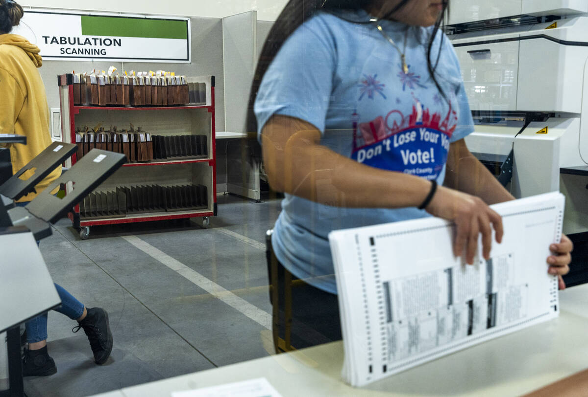 A worker continues sorting ballots for final tabulations at the Clark County Election Departmen ...