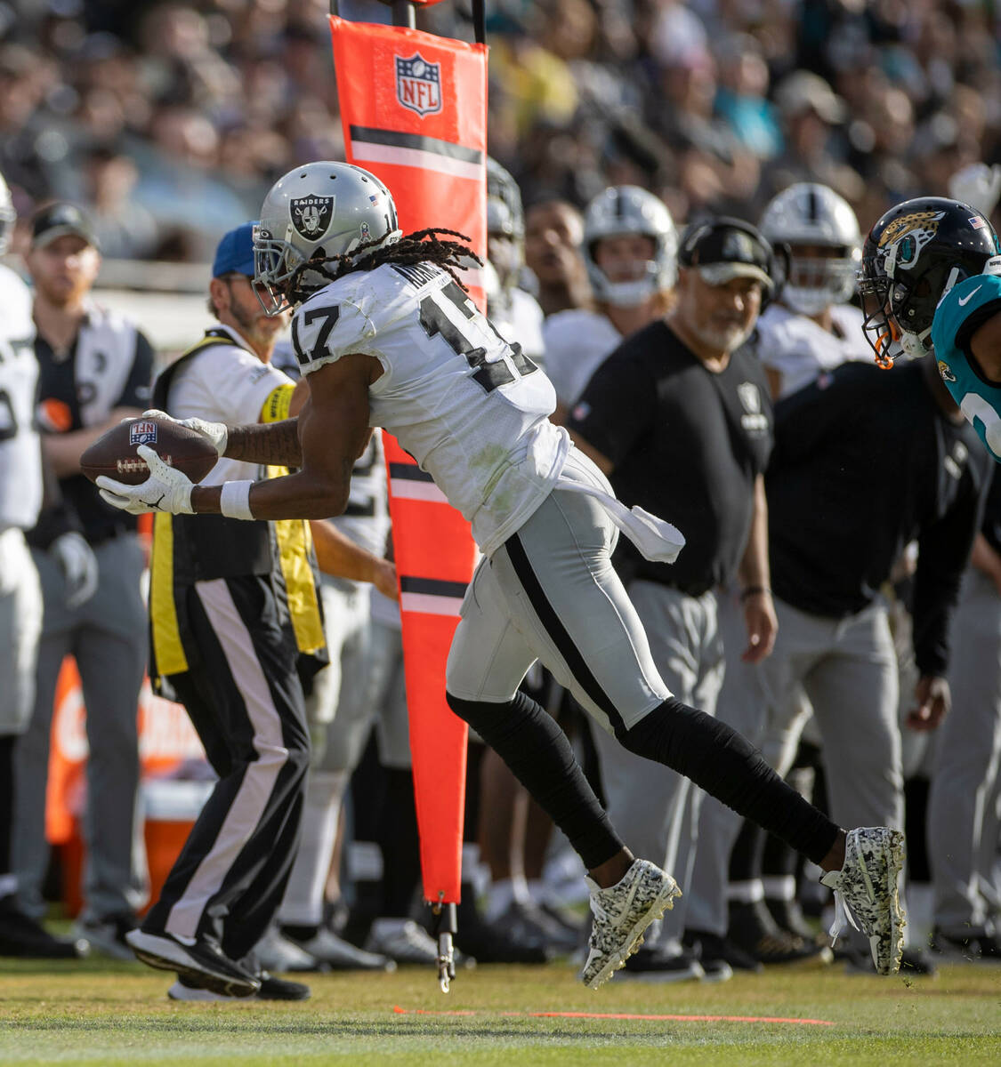 Raiders wide receiver Davante Adams (17) can’t haul in a catch for a completion during t ...