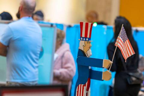 Voters line up to cast their vote at Galleria at Sunset, on Tuesday, Nov. 8, 2022, in Henderson ...