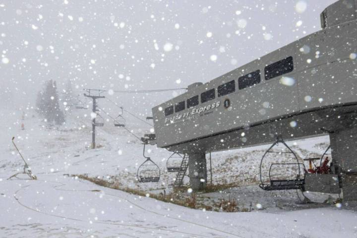 This photo shows the sky lift during the first snow fall at Mammoth Mountain, Calif. on Tuesday ...