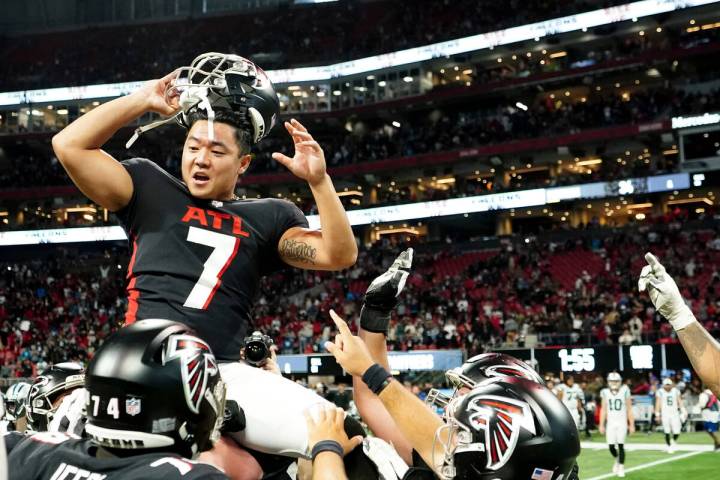 Atlanta Falcons place kicker Younghoe Koo is congratulated by teammates after kicking a field g ...