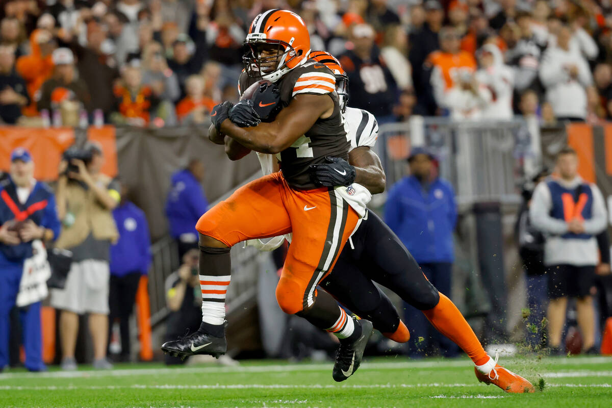 Cincinnati Bengals linebacker Germaine Pratt (57) attempts to tackle Cleveland Browns running b ...