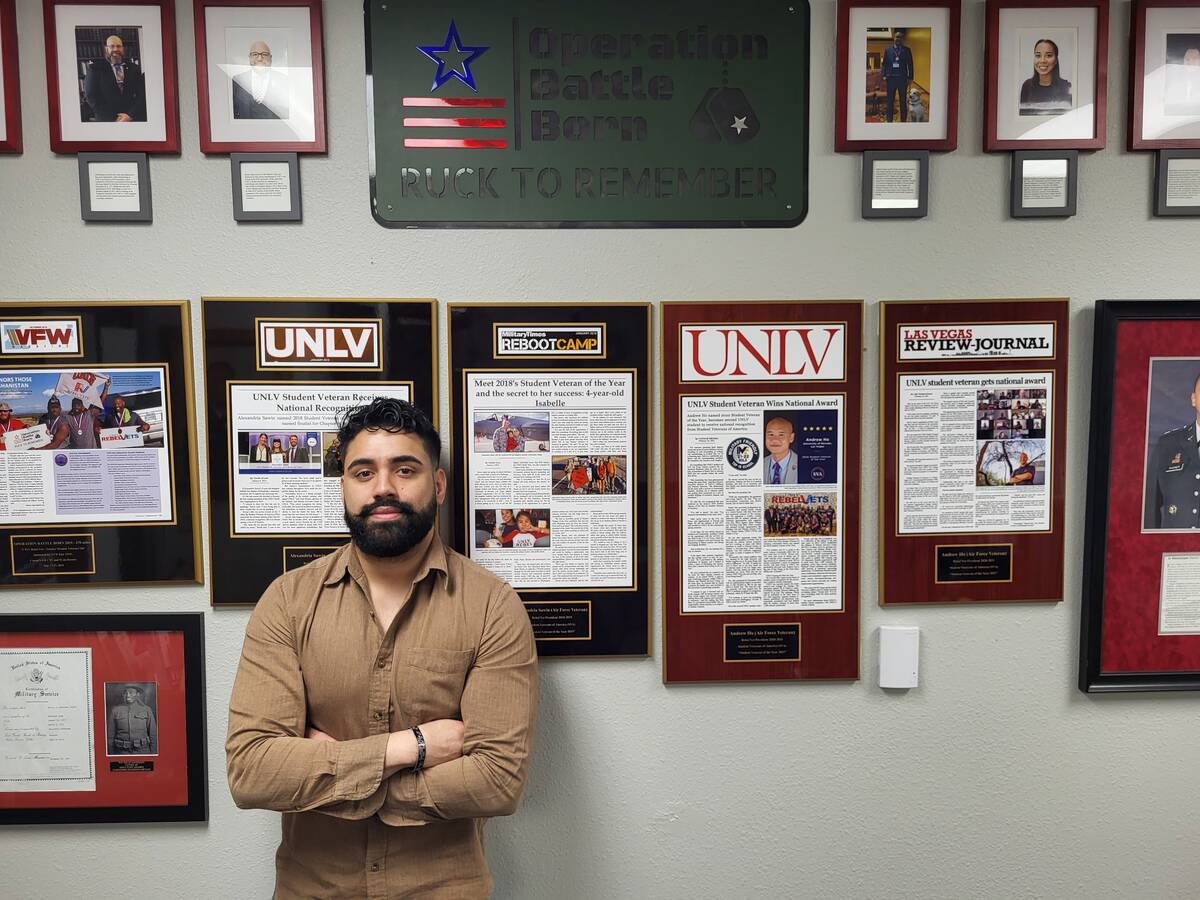 Omar Lopez in front of the story wall in the MVSC. (Photo by Mark Credico)