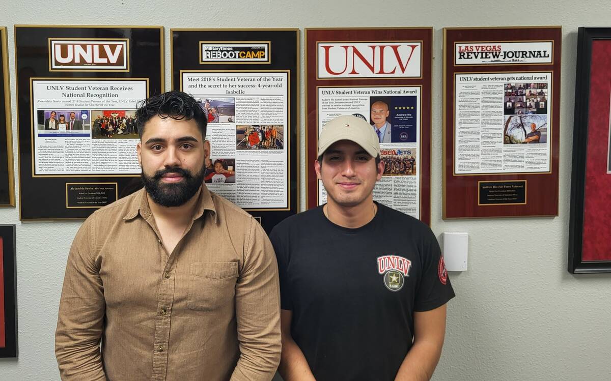 Omar Lopez, left, and Franklin La Rosa Diaz stanin front of the story wall in the MVSC. (Photo ...
