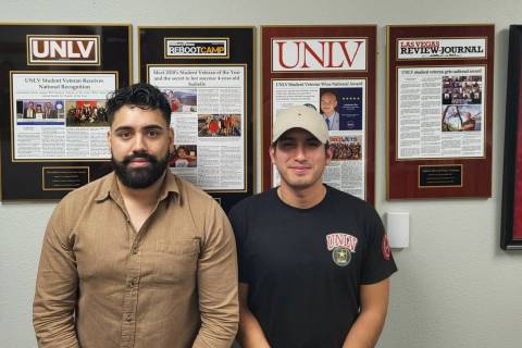 Omar Lopez, left, and Franklin La Rosa Diaz stanin front of the story wall in the MVSC. (Photo ...