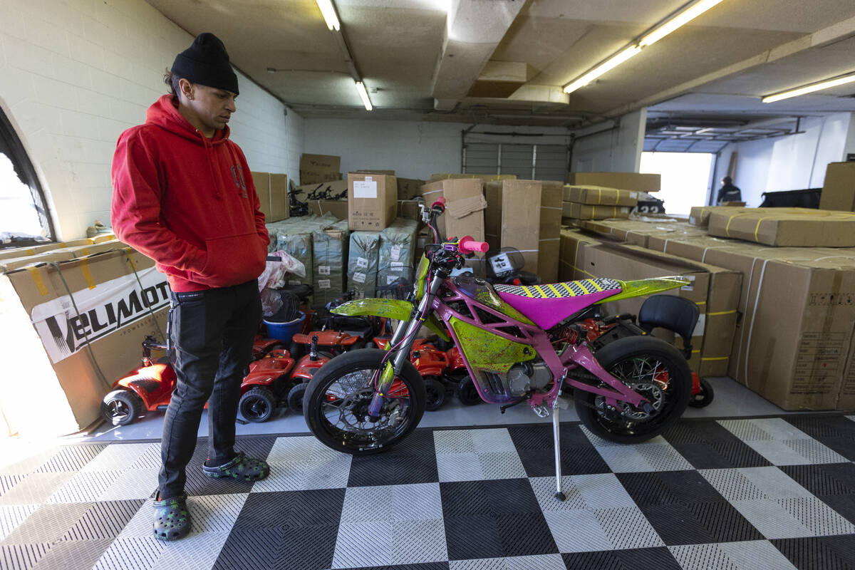 Derrek Miranda, shop supervisor for E-Power Sport shop, shows his custom e-bike in Las Vegas on ...