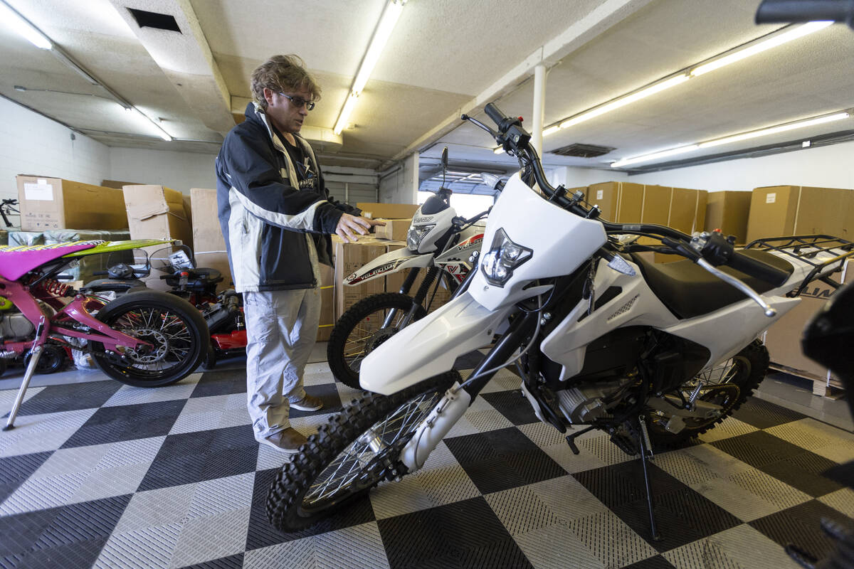 John Reagan, owner of E-Power Sport, gives a tour of the showroom floor of his e-bike shop in L ...
