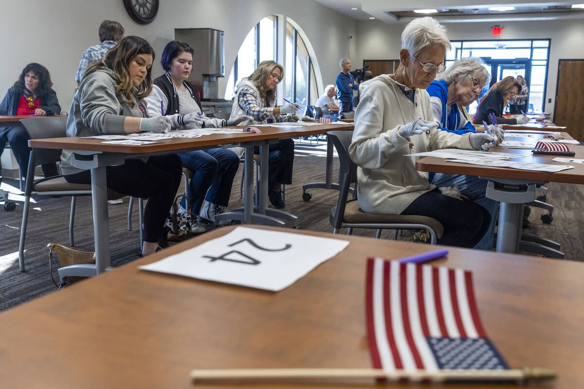 Volunteers resume hand counting ballots in Nye County at the Valley Conference Center on Thursd ...