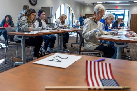 Volunteers resume hand counting ballots in Nye County at the Valley Conference Center on Thursd ...