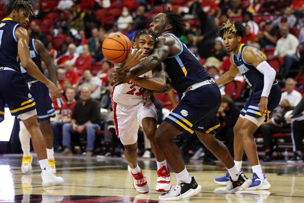 UNLV Rebels guard Jackie Johnson III (24) is fouled by Southern University Jaguars forward Jale ...