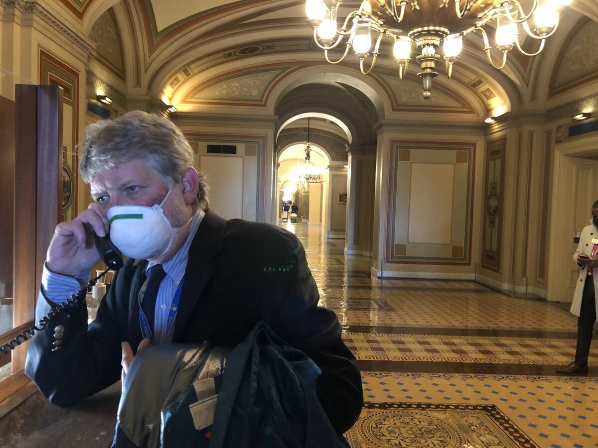 Gary Martin on the phone with a contact inside the lobby of the U.S. Capitol building on Jan. 1 ...