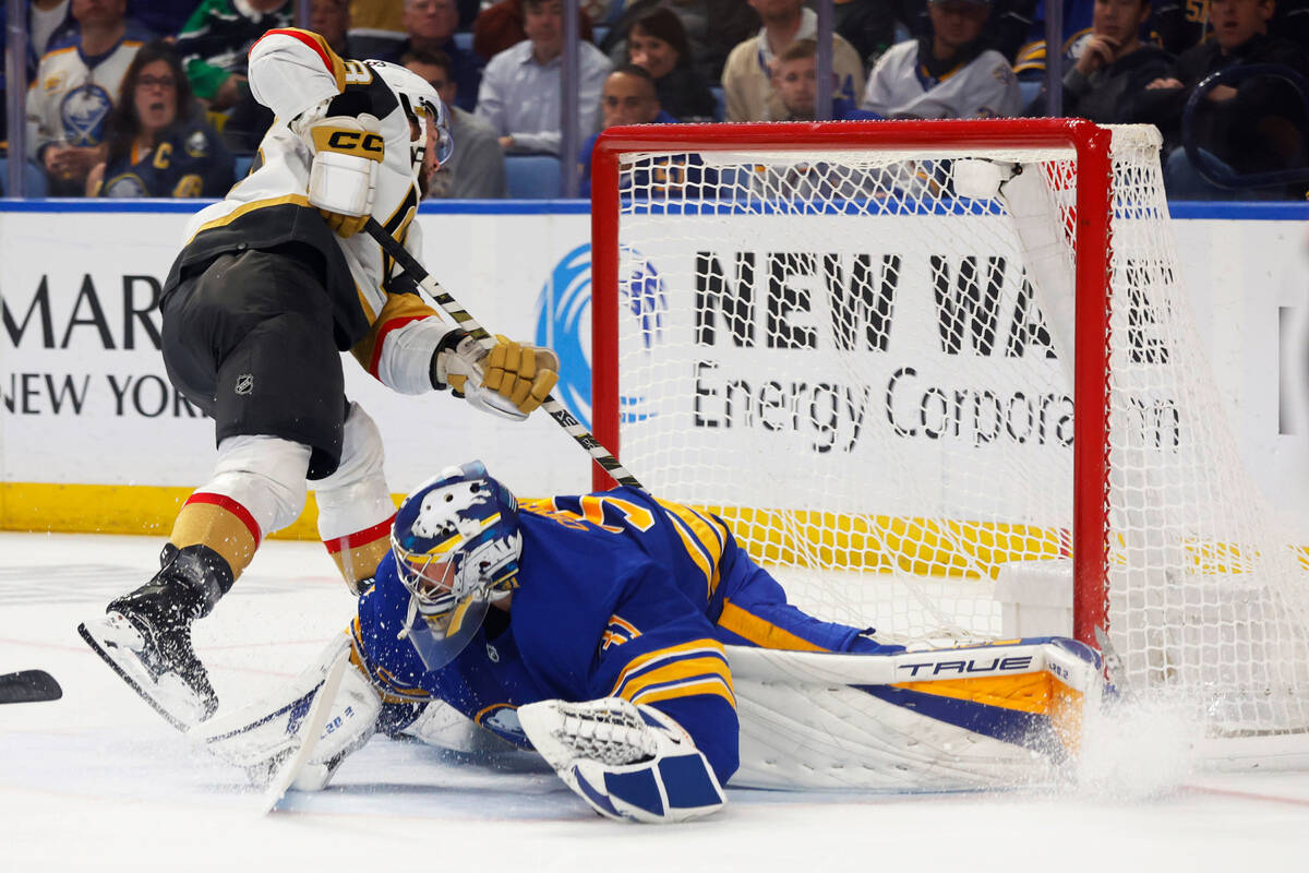 Vegas Golden Knights left wing William Carrier (28) puts the puck past Buffalo Sabres goaltende ...