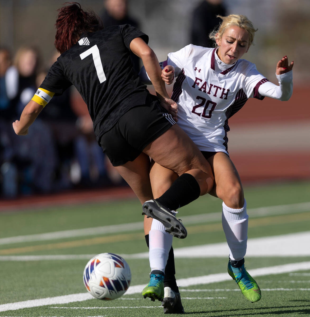 Faith Lutheran’s Ava Gardner (20) attempts to pass while colliding with Galena’s ...