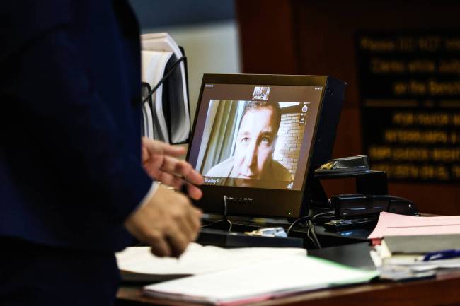 Bradley Sones, a Bureau of Land Management officer, addresses the court as a witness via BlueJe ...