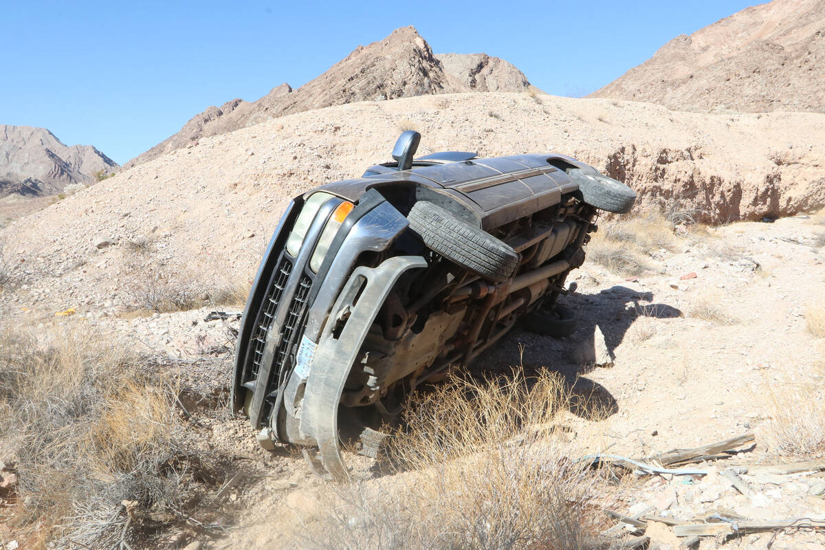 The overturned truck driven by the suspected car thieves. A BLM trainee shot seven rounds into ...