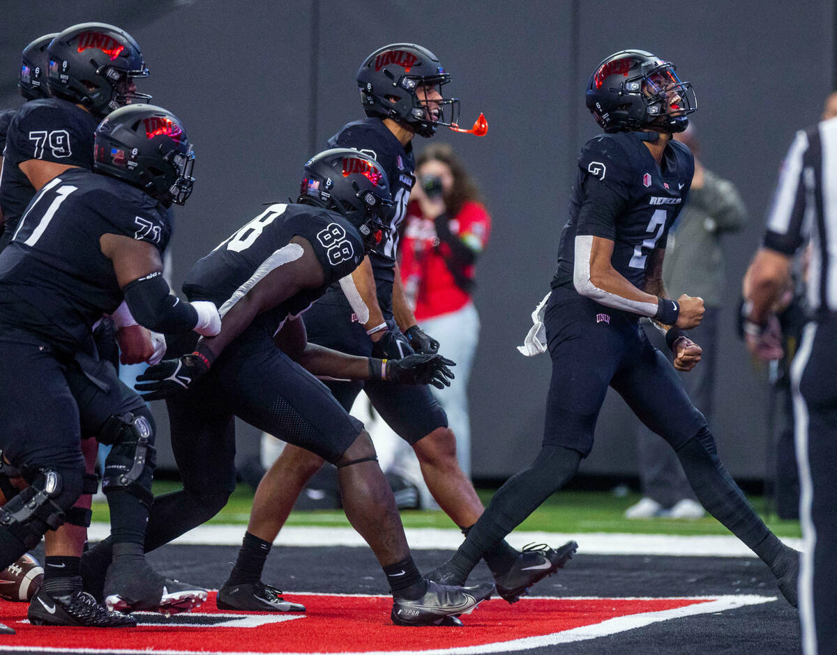 UNLV Rebels quarterback Doug Brumfield (2) celebrates a score with teammates over the Fresno St ...