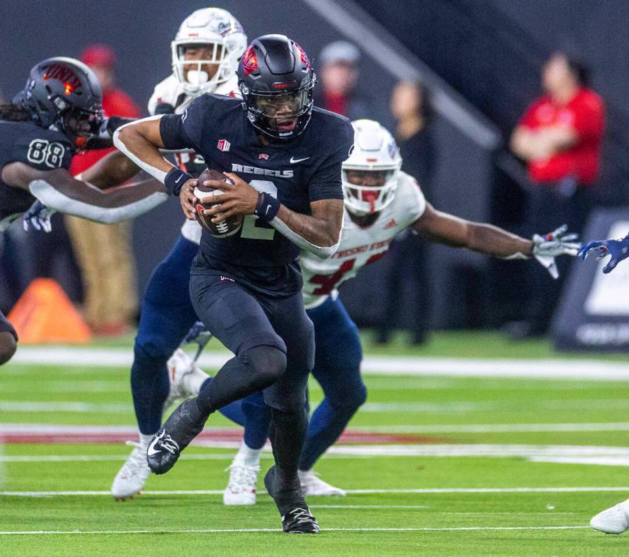 UNLV Rebels quarterback Doug Brumfield (2) runs for a first down over the Fresno State Bulldogs ...
