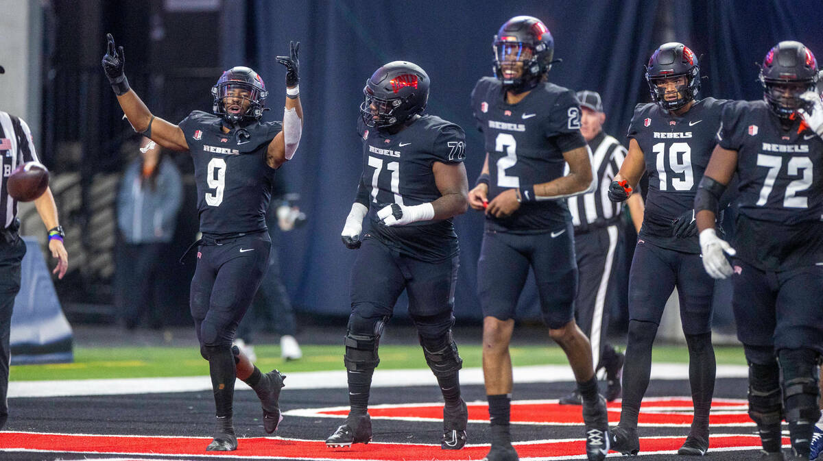 UNLV Rebels running back Aidan Robbins (9) celebrates a long touchdown run versus the Fresno St ...