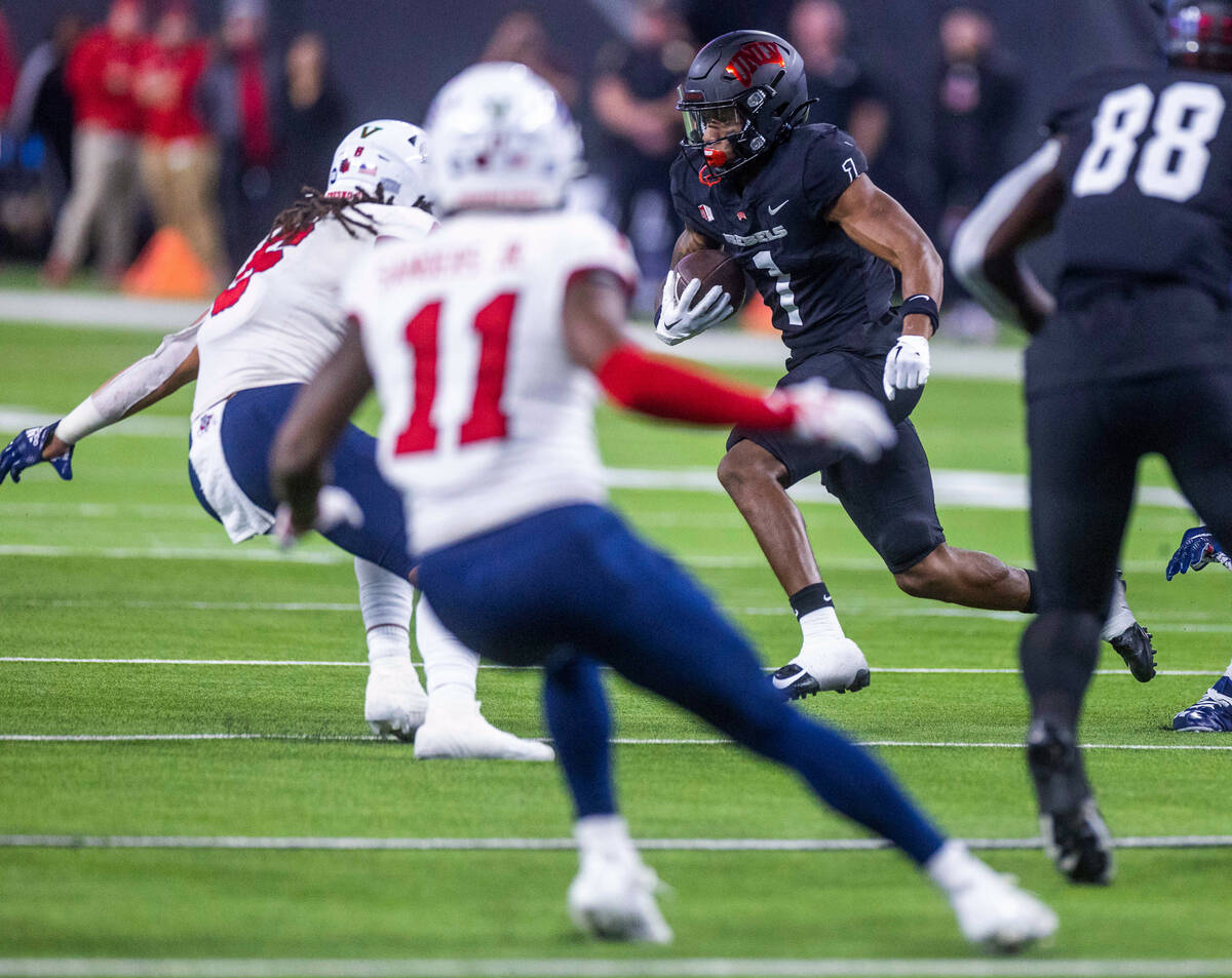 UNLV Rebels wide receiver Kyle Williams (1) looks for more yards after a catch versus Fresno St ...