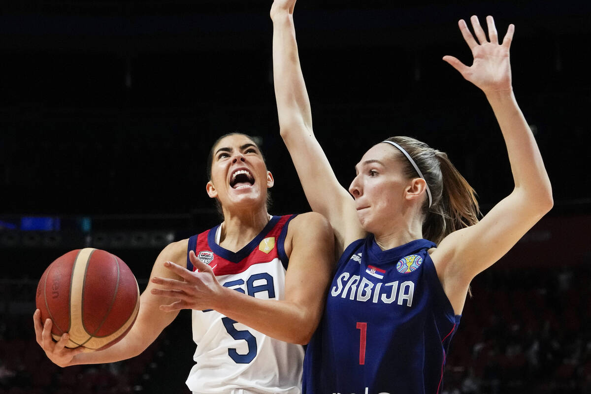 United States' Kelsey Plum runs past Serbia's Ivana Raca during their quarterfinal game at the ...