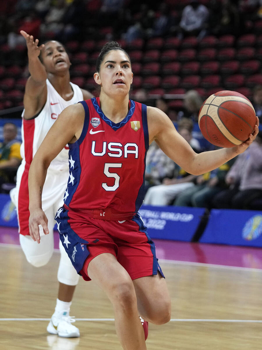 United States' Kelsey Plum, right, runs away from the Canadian defense for an easy lay up durin ...