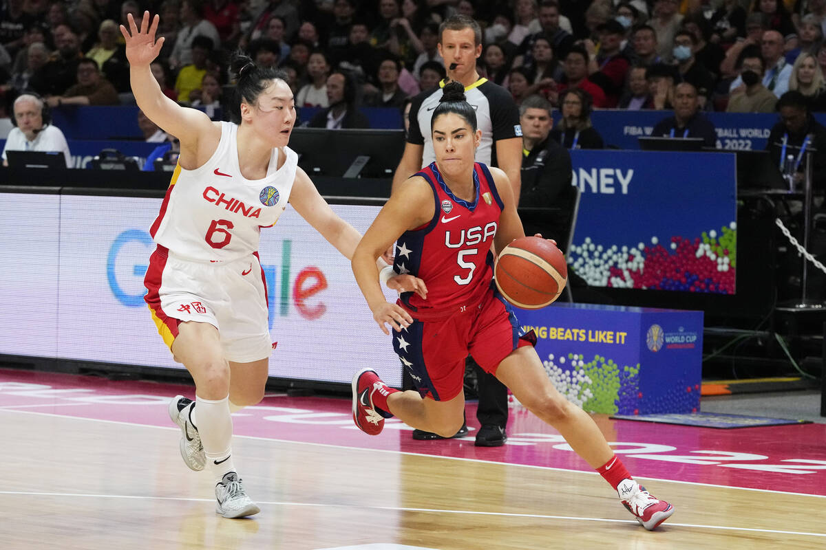 United States' Kelsey Plum runs past China's Wu Tongtong during their gold medal game at the wo ...
