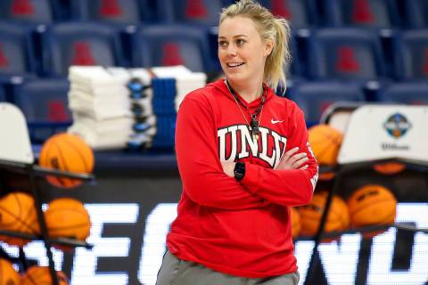 UNLV coach Lindy La Rocque smiles while watching the team shoot layups during practice for the ...