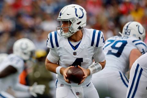 Indianapolis Colts quarterback Sam Ehlinger (4) plays against the New England Patriots in the f ...