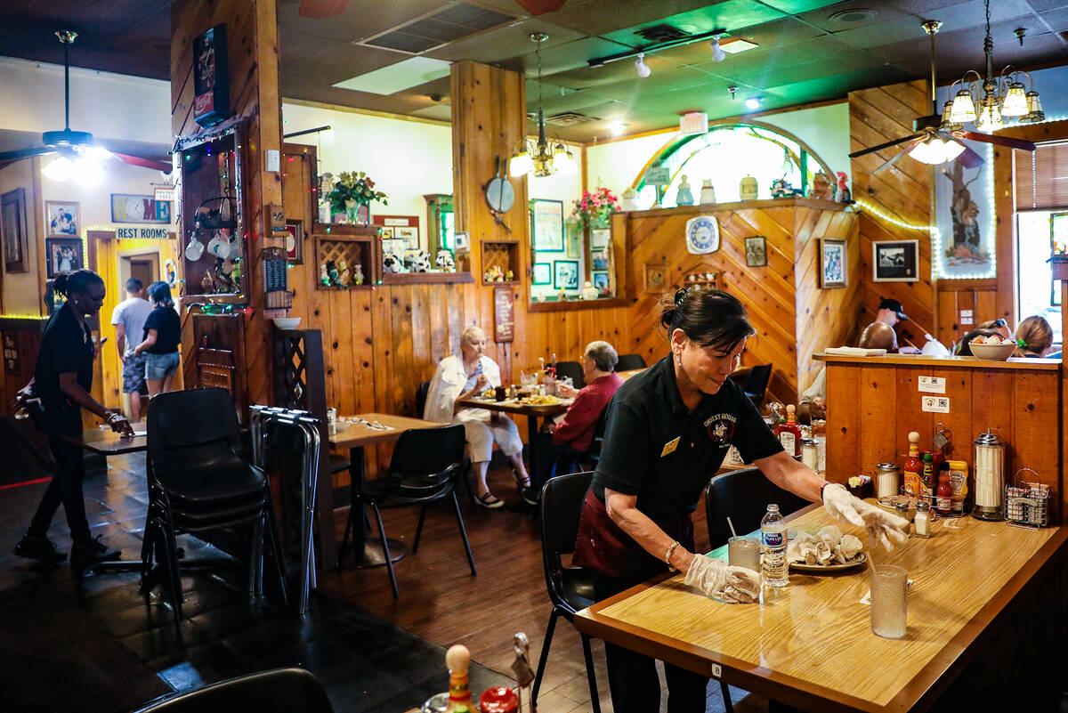 Hostess Jean Vallejera cleans off a table at The Omelet House at their central Las Vegas locati ...
