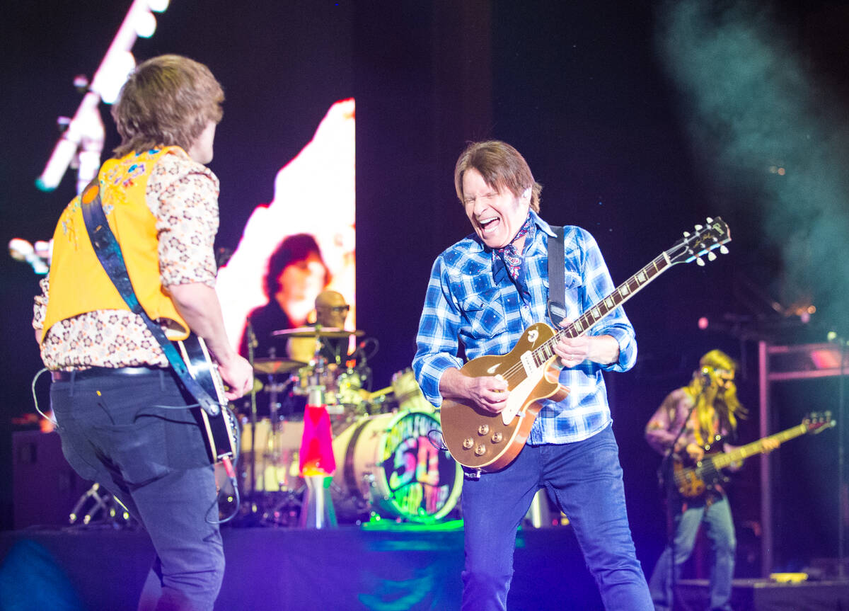 John Fogerty, shown with his son Shane, plays Red Rocks Amphitheater in Colorado on June 20, 20 ...