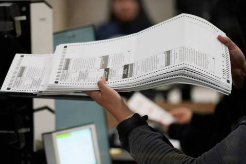 An election worker processes ballots at the Clark County Election Department, Friday, Nov. 11, ...
