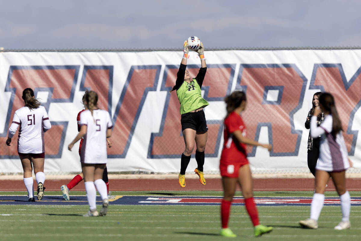 Faith Lutheran’s goalkeeper Elke Travis jumps to save during a Class 5A girls high schoo ...