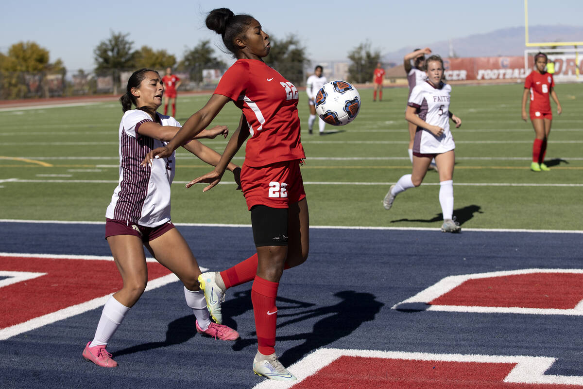 Coronado’s Sierah McCallum (22) receives a pass while Faith Lutheran’s Riley Rent ...