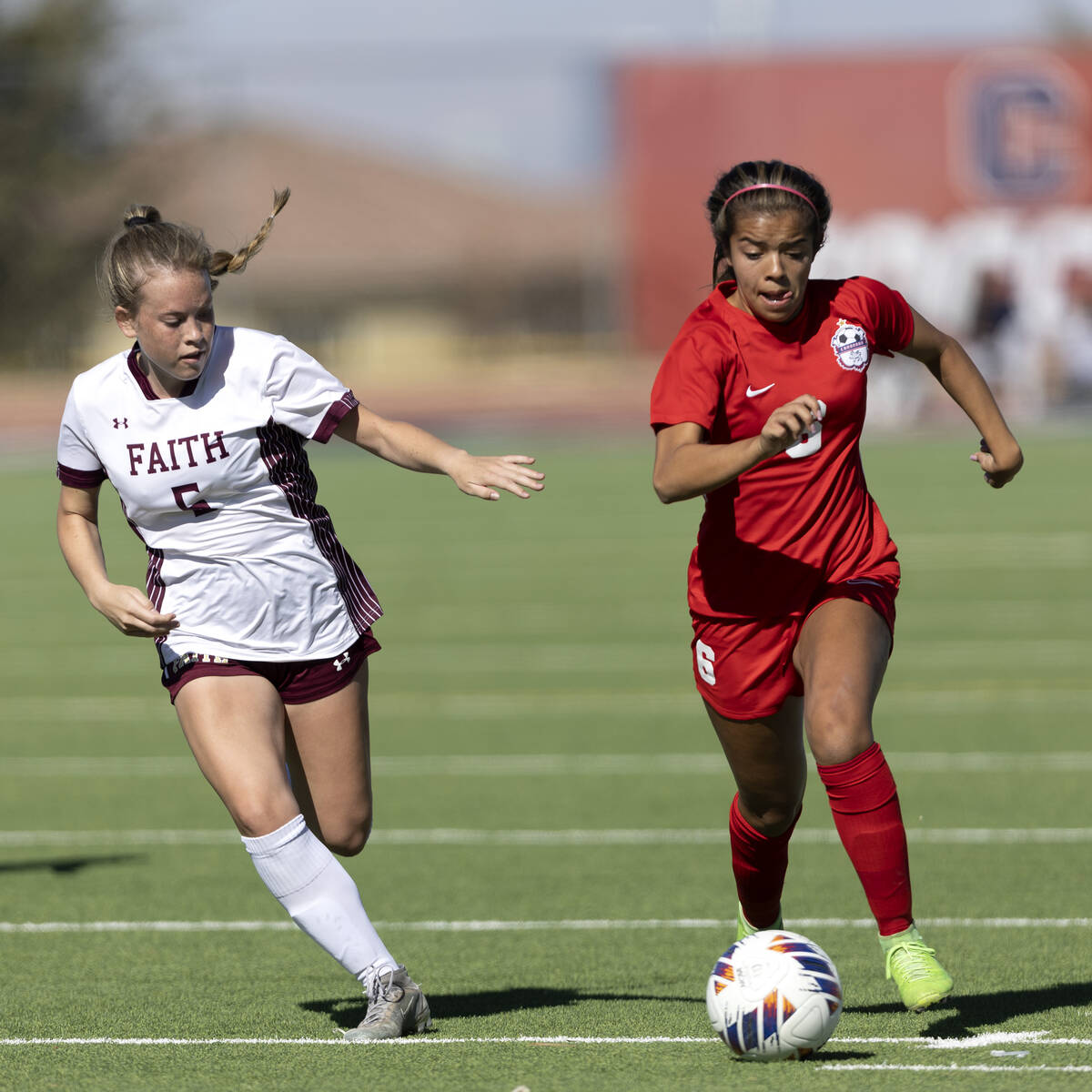 Coronado’s Milan Cordone, right, dribbles against Faith Lutheran’s McKenna Becket ...