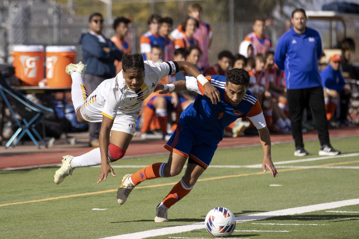 Eldorado’s Eric Hodges, left, files into the air while defending against Bishop Gorman&# ...