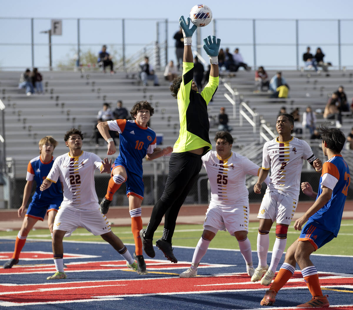Eldorado goalkeeper Jose Barriga, center, jumps to save during a Class 5A boys high school socc ...