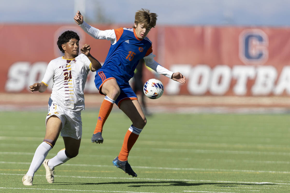 Bishop Gorman’s Chase Stewart (15) and Eldorado’s Ricardo Velez (24) jump for pos ...