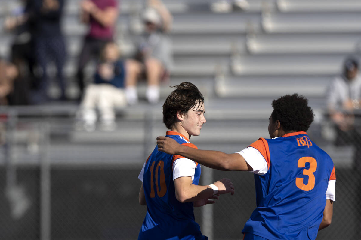 Bishop Gorman’s Luke Parker (10) celebrates with Bronson Rolley (3) after scoring a goal ...