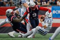 New England Patriots defensive tackle Daniel Ekuale (95) and linebacker Matthew Judon (9) sack ...