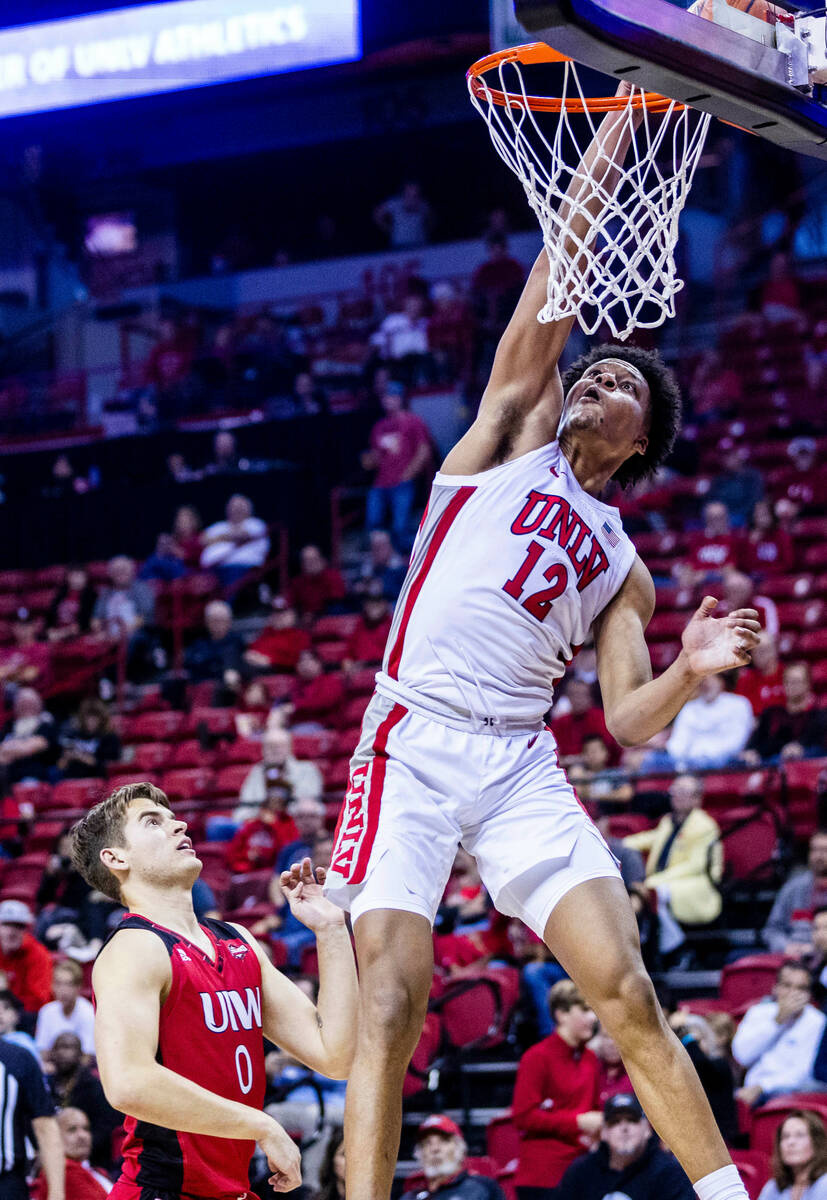 UNLV Rebels center David Muoka (12) looks to score over Incarnate Word Cardinals guard Dylan Ha ...