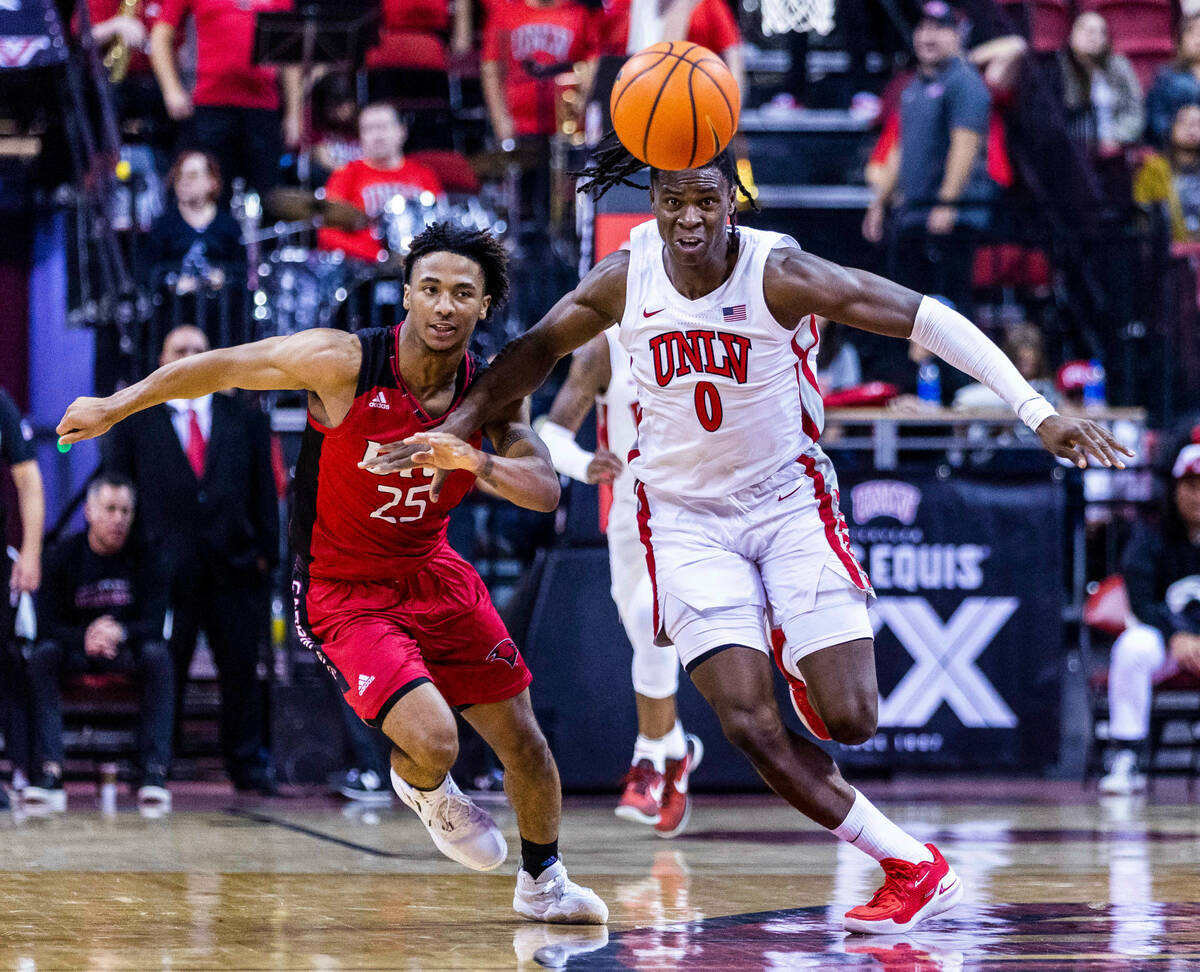 UNLV Rebels forward Victor Iwuakor (0) and Incarnate Word Cardinals guard Trey Miller (25) figh ...