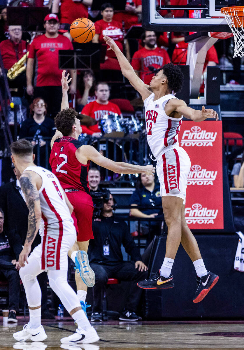 UNLV Rebels center David Muoka (12) rejects a shot by Incarnate Word Cardinals guard Niki Kraus ...