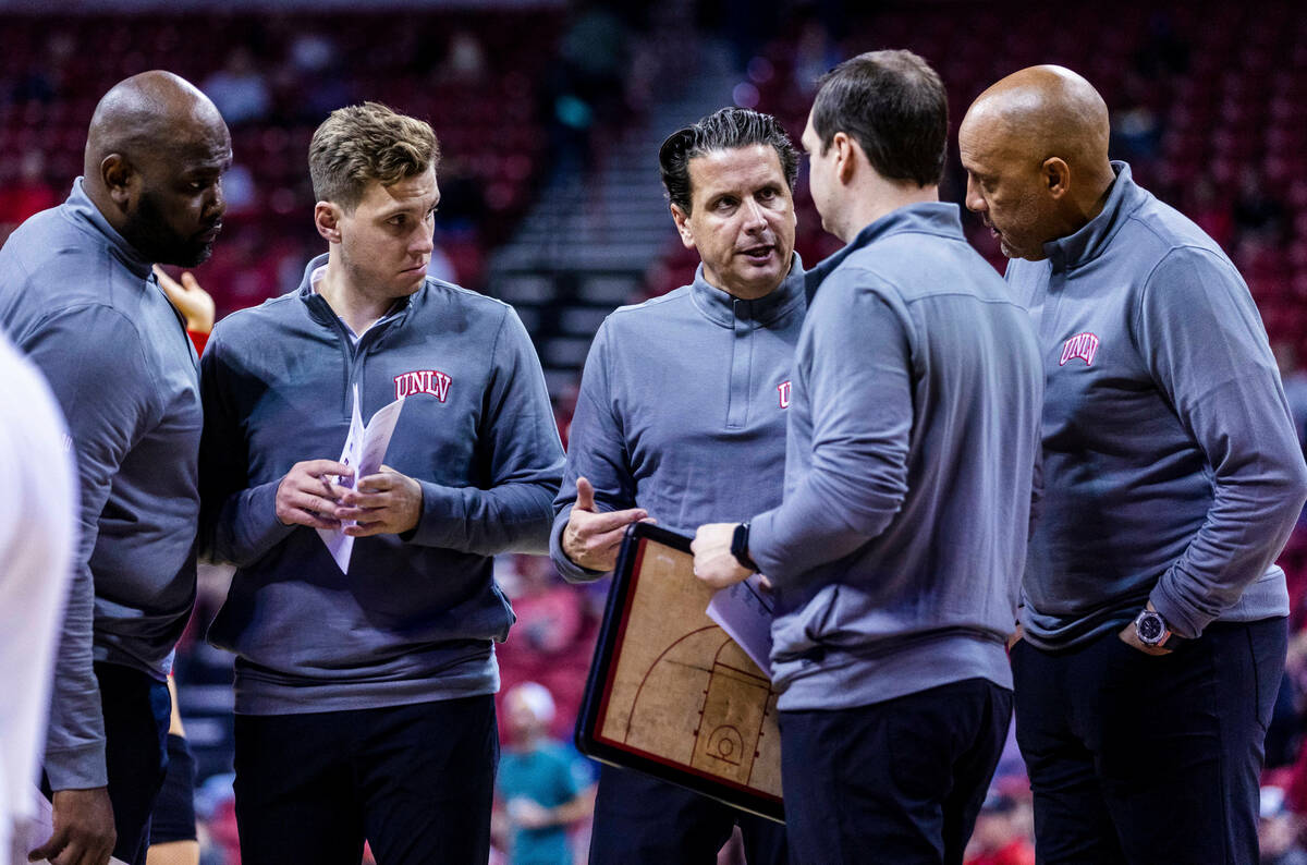 UNLV coaches confer on a timeout versus the Incarnate Word Cardinals during the second half of ...