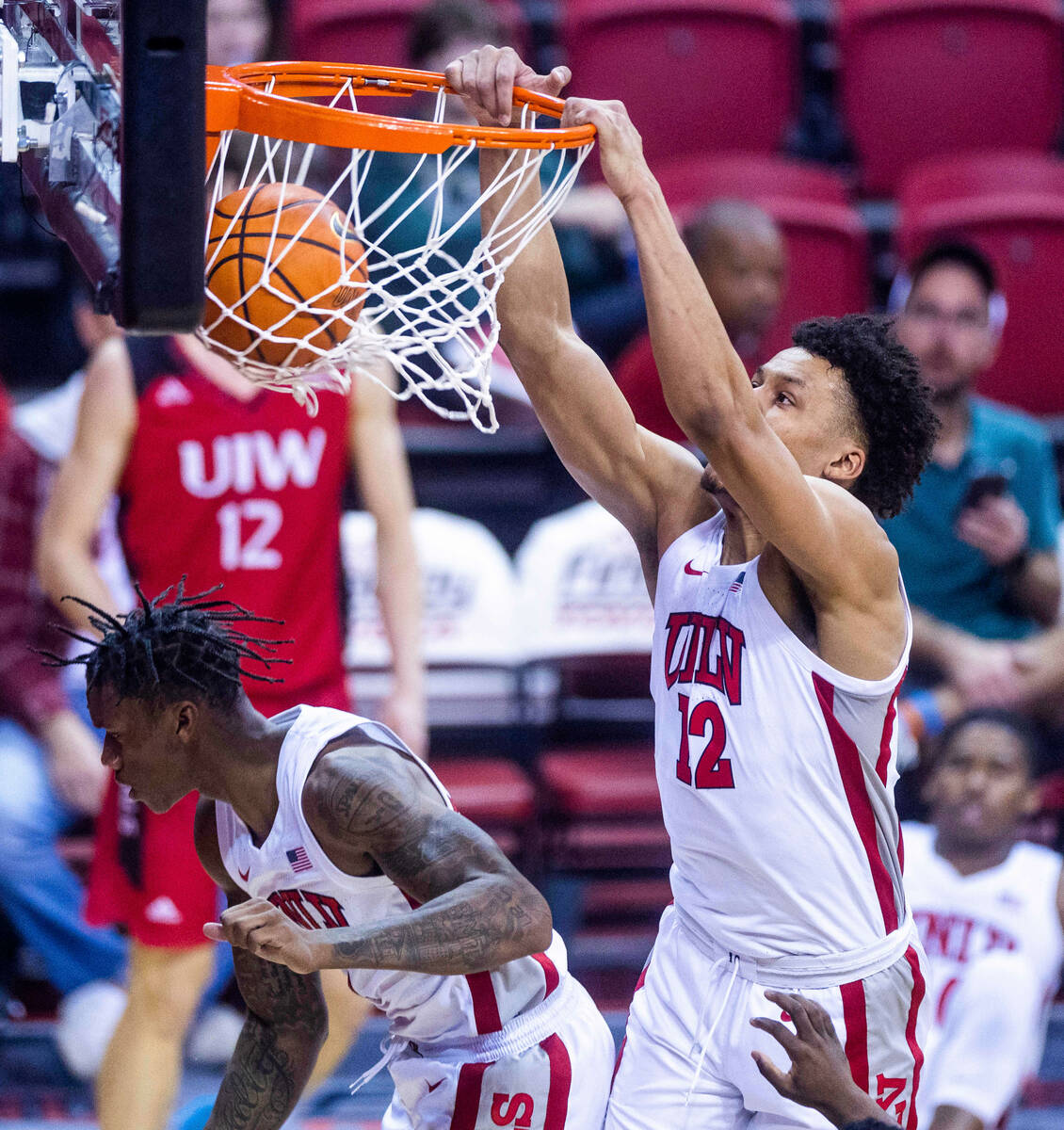 UNLV Rebels center David Muoka (12) dunks the ball over the Incarnate Word Cardinals during the ...